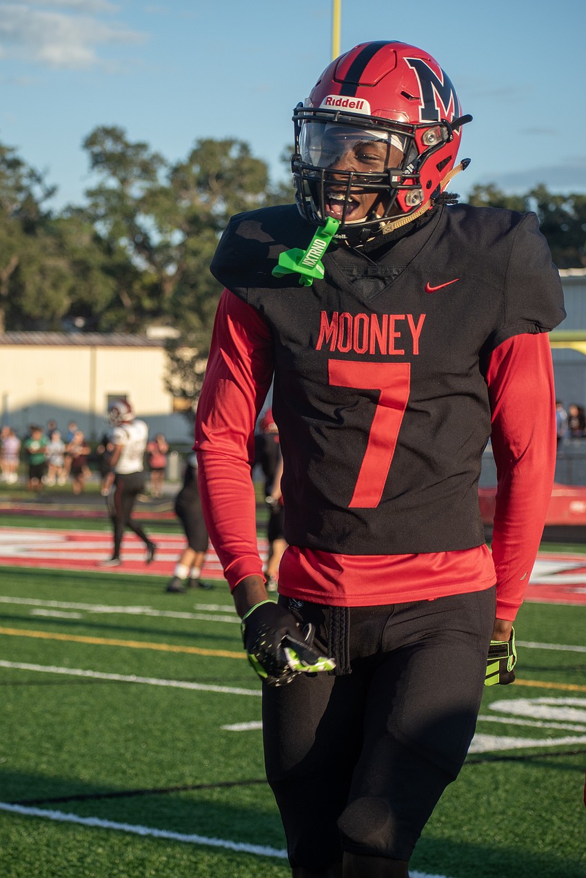 Cardinal Mooney senior Zy'marion Lang celebrates after returning a fumble for a touchdown against Riverview.