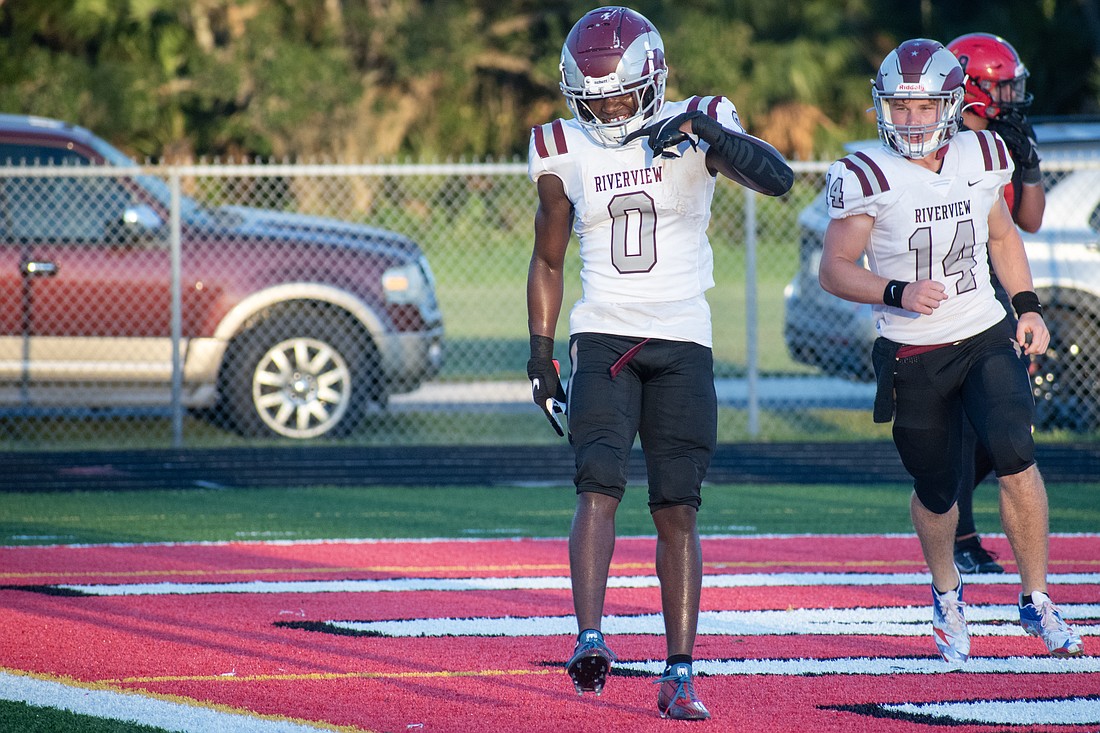 Riverview High junior DJ Johnson celebrates after scoring a rushing touchdown.