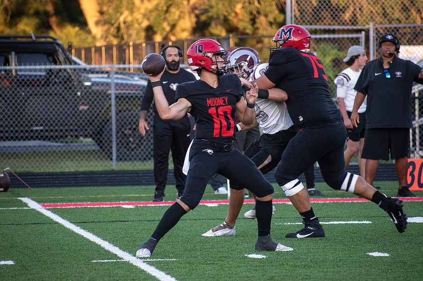Cardinal Mooney senior quarterback Michael Valentino throws downfield.