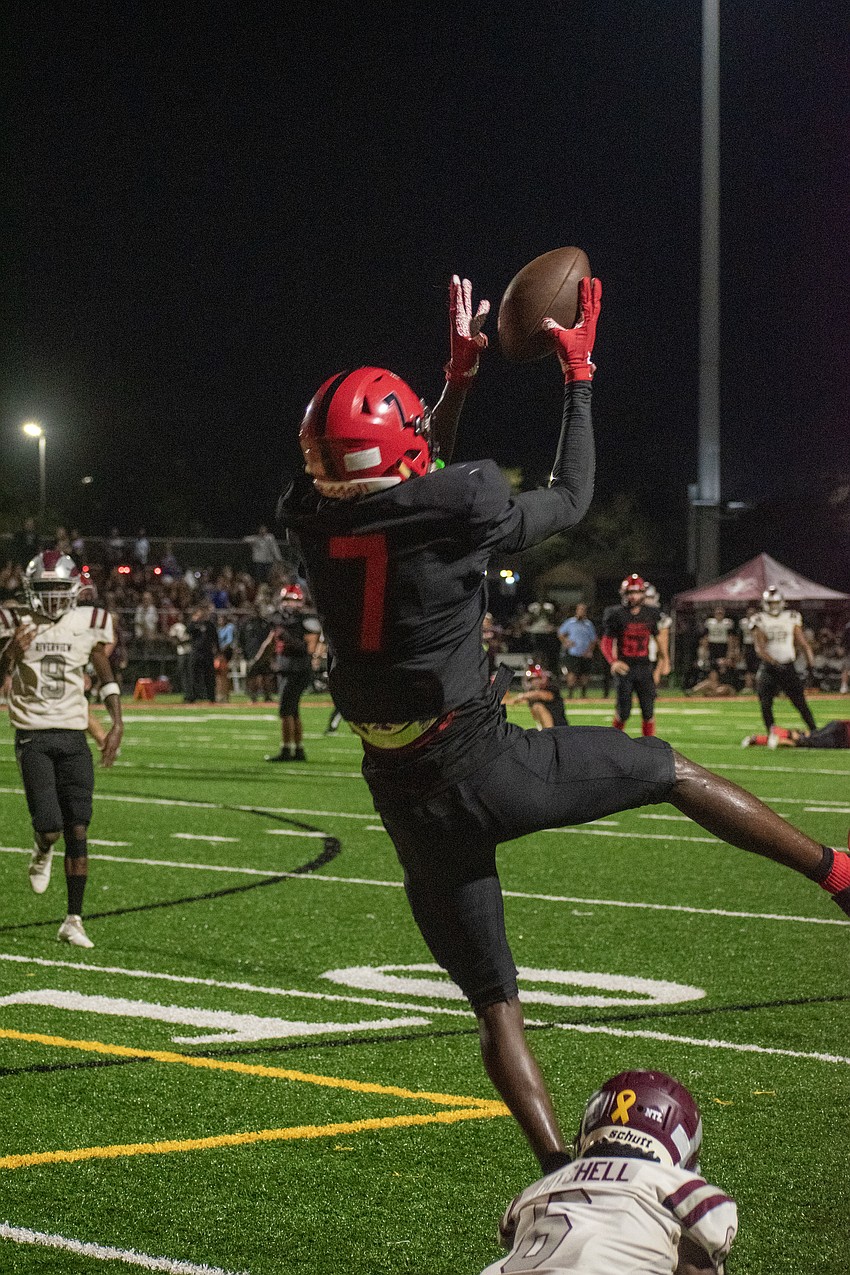 Cardinal Mooney senior receiver Zy'marion Lang makes a leaping catch against Riverview.