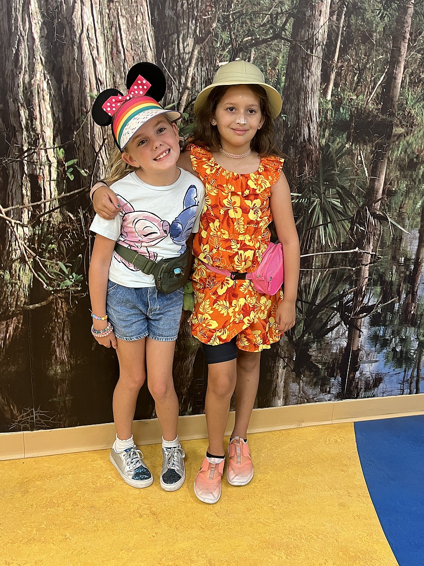 Third graders Rose Kessler and Hadley Drohan dress as tacky tourists. 
