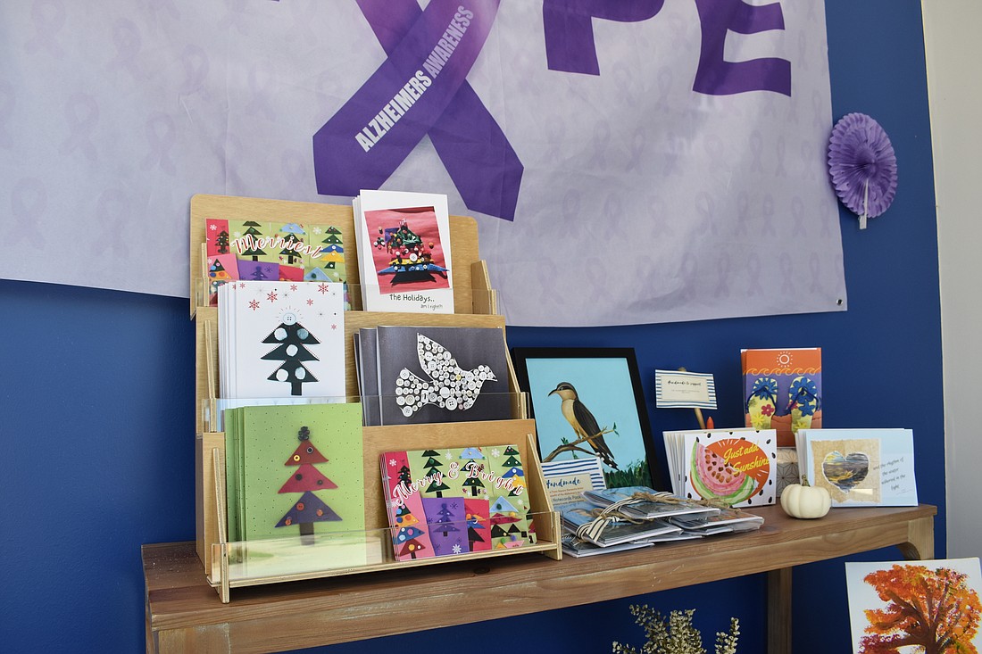 Greeting cards featuring art created by the seniors are set out on display at the entrance to Town Center Sarasota.