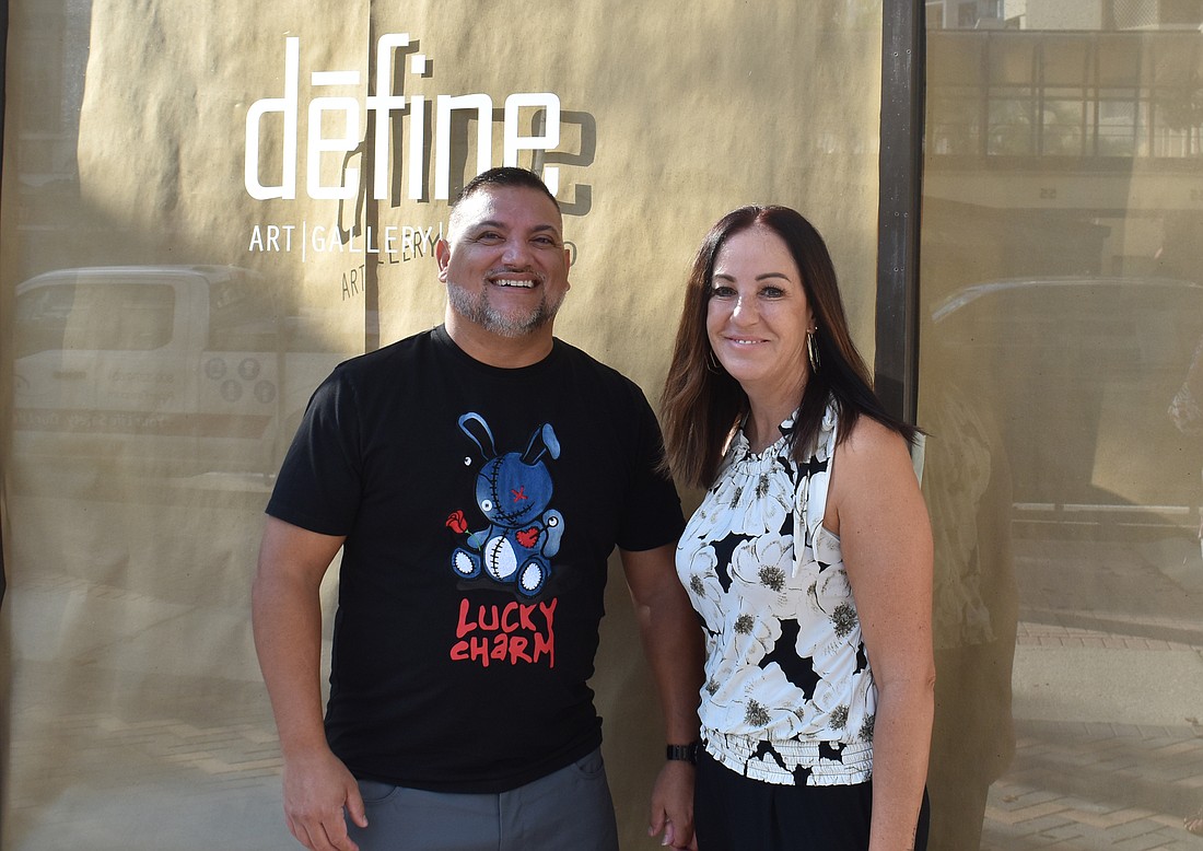 Casey and Deena King pose outside their Define Art Gallery, which is moving to 68 S. Palm Ave.