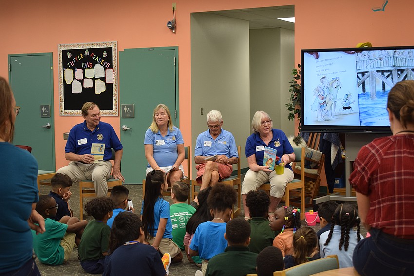 Jack Rozance, Susan McGuire, James Chirgwin and Carol Erker leading the first read aloud of the Rotary Club's 
