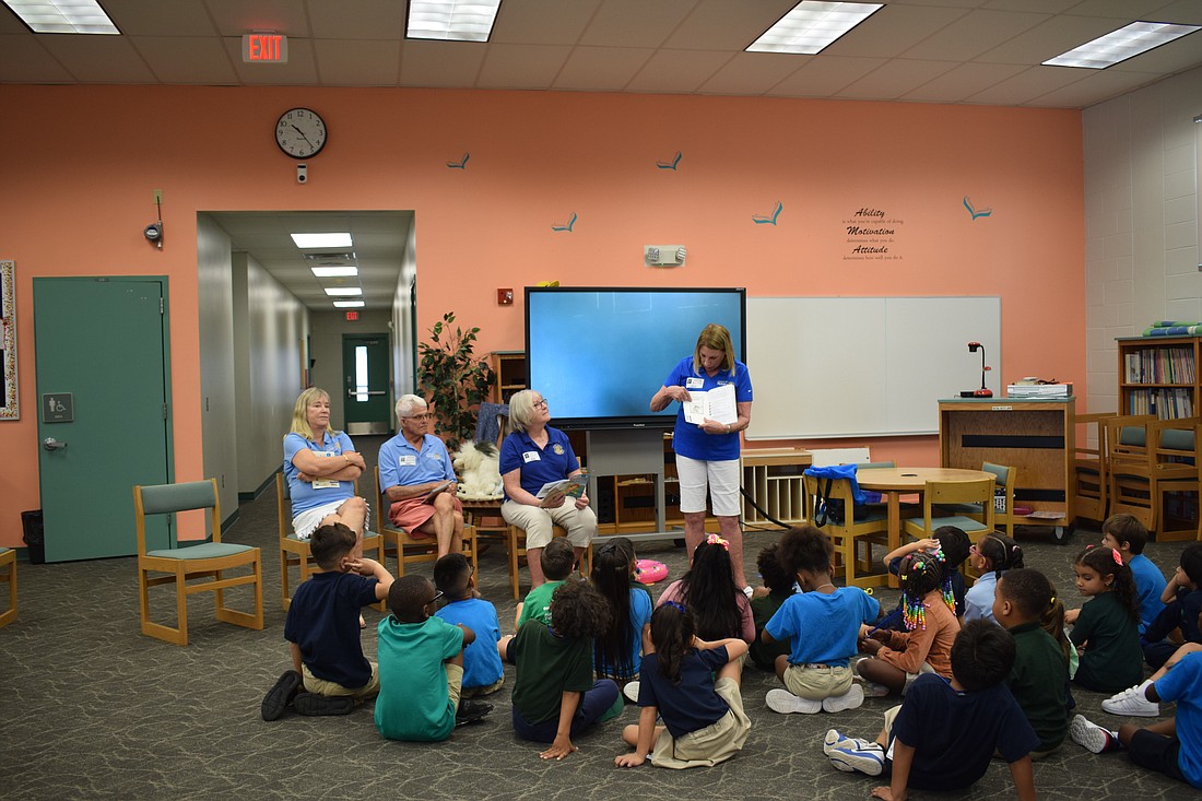 Susan McGuire, James Chirgwin, Carol Erker and Nancy Rozance at Tuttle Elementary School on Sept. 15.
