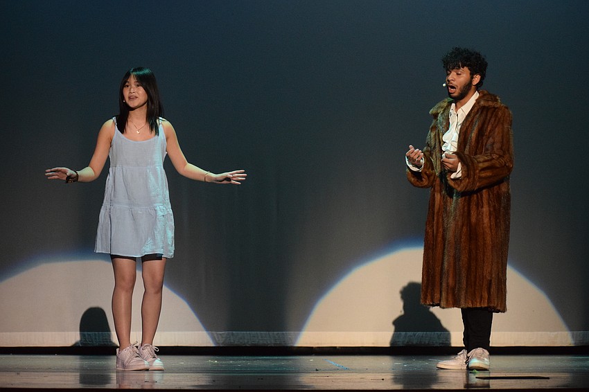 Hayleigh Vuong portrays Belle while Zeke Lopez portrays the Beast during a performance of 