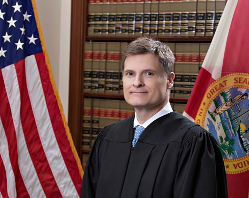 State Supreme Court Chief Justice Carlos Muñiz.