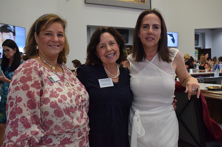Lakewood Ranch's Laurel Corriveau and Sarasota's Kathryn Carr and Clara Villanueva are ready to see if they'll become winners during Designer Bag Bingo.