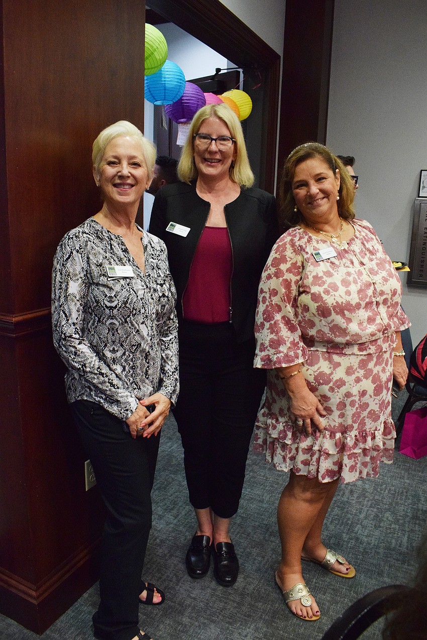 Sisterhood for Good members Lakewood Ranch's June Braithwaite, Bradenton's Christina Sisti and Lakewood Ranch's Laurel Corriveau look forward to the sense of community and giving back to the community at Designer Bag Bingo.