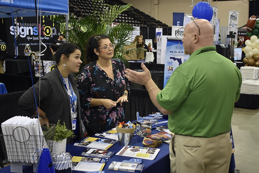 Lakewood Ranch's Maddie Anello and Jennifer Barbaro of Keiser University talk with Lakewood Ranch's Jason Ziarno.