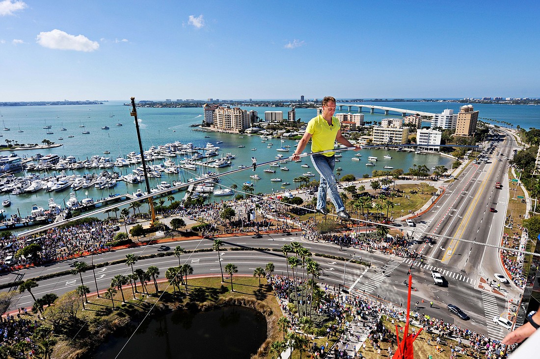 Aerialist Nik Wallenda walks the wire above his hometown of Sarasota in January 2013.