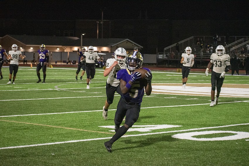 Booker senior receiver Joshua Burrows catches a ball behind the Braden River defense. Burrows would take the catch for a 60-yard touchdown.