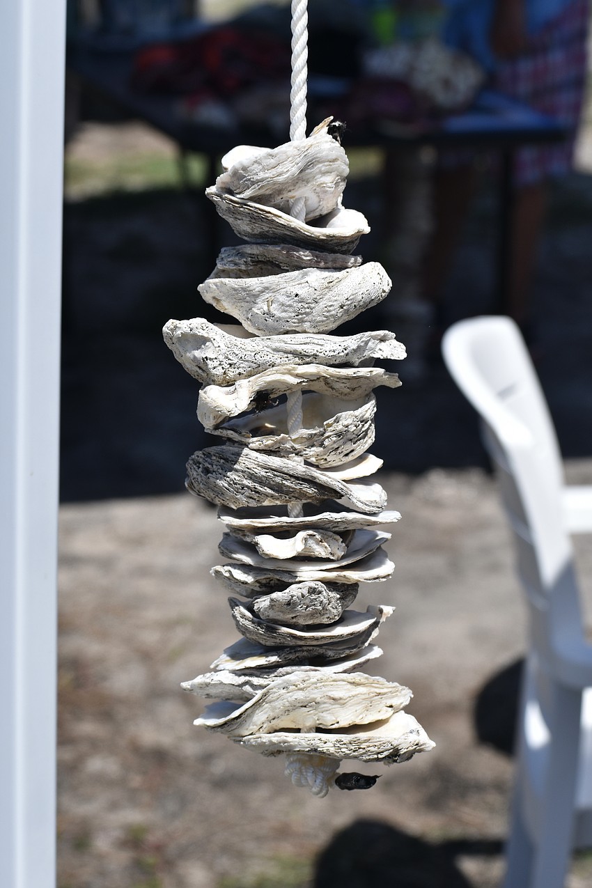 An oyster garden hangs at the Oyster Boys Conservation stand.