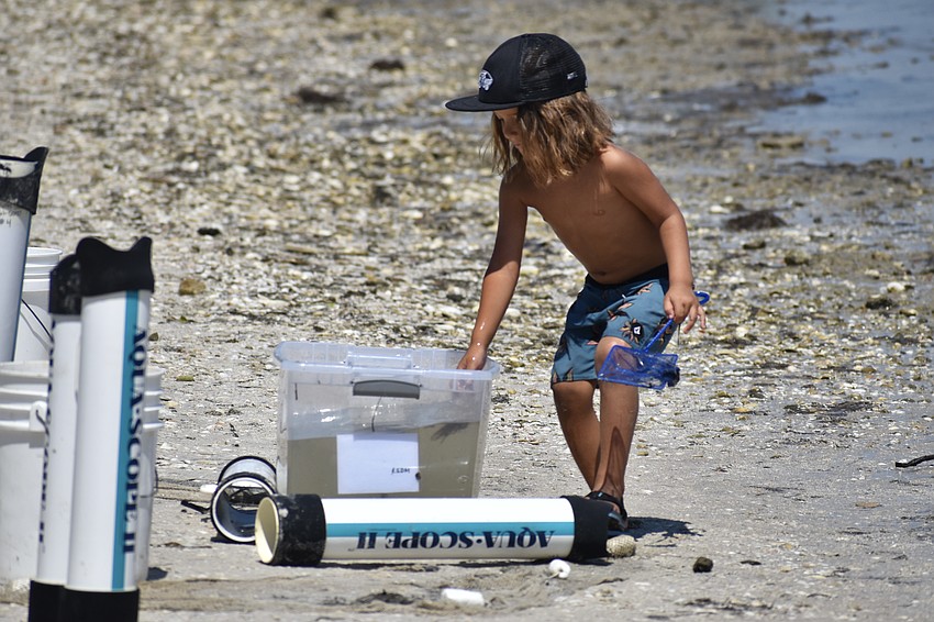 Landon Varsek, 4, enjoys the results of the dip netting.