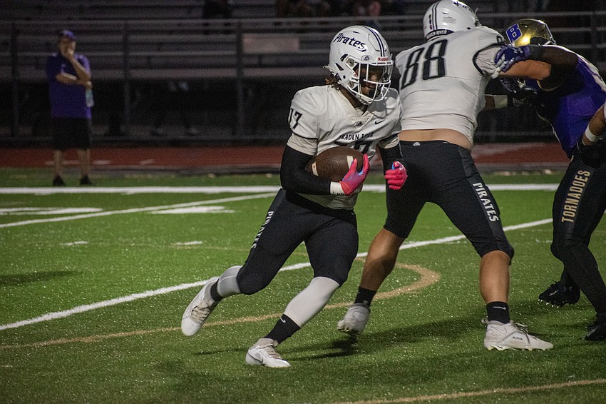 Braden River junior receiver/running back Yahshua Edwards cuts through the Booker defense.