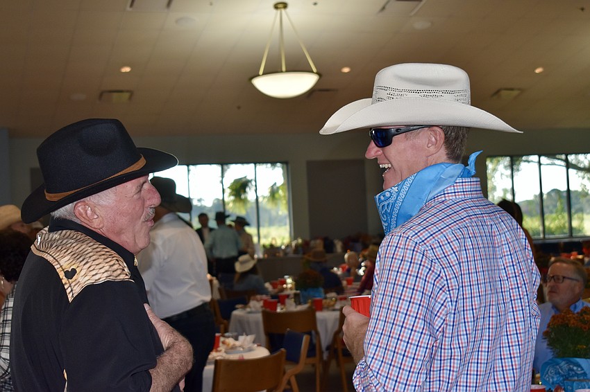 Venice resident Rick Marziano chats with Carlos Spiess, who traveled from Connecticut because he 