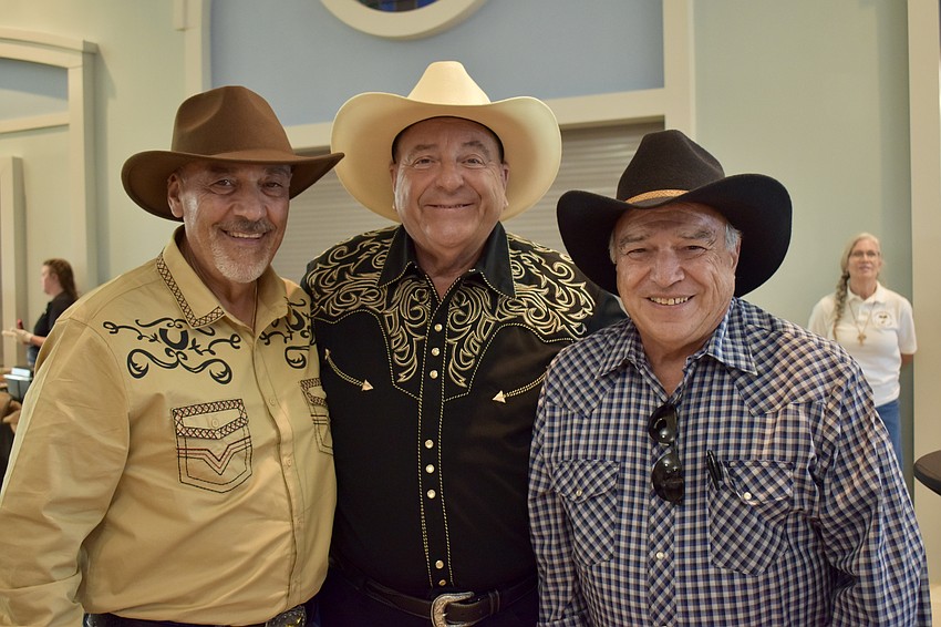 Three Italian cowboys: Vinnie Cipriano, Frank Dillon and Al Connizzo. Connizzo serves on the Board of Catholic Charities.
