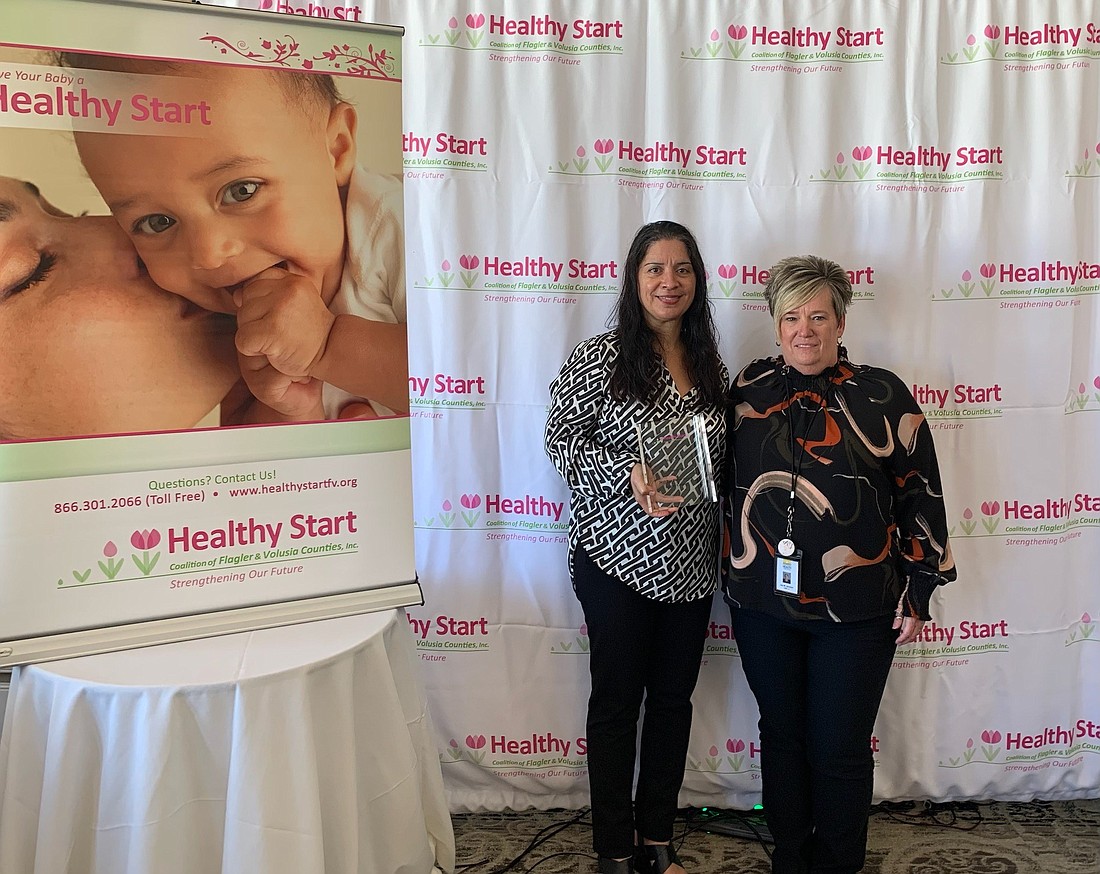 DOH-Flagler dentist Frances Bey (left) with Dental Clinic Operations Manager Lisa Sanchez at the Healthy Start Coalition annual meeting on Sept. 22. Dr. Bey won the Ron Fisher Award for Flagler County.