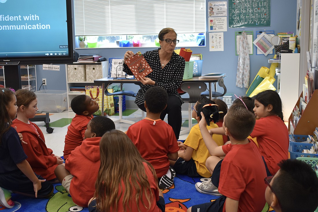 Second grade teacher Jessica Perez Maquedo holds a storytime for the class.
