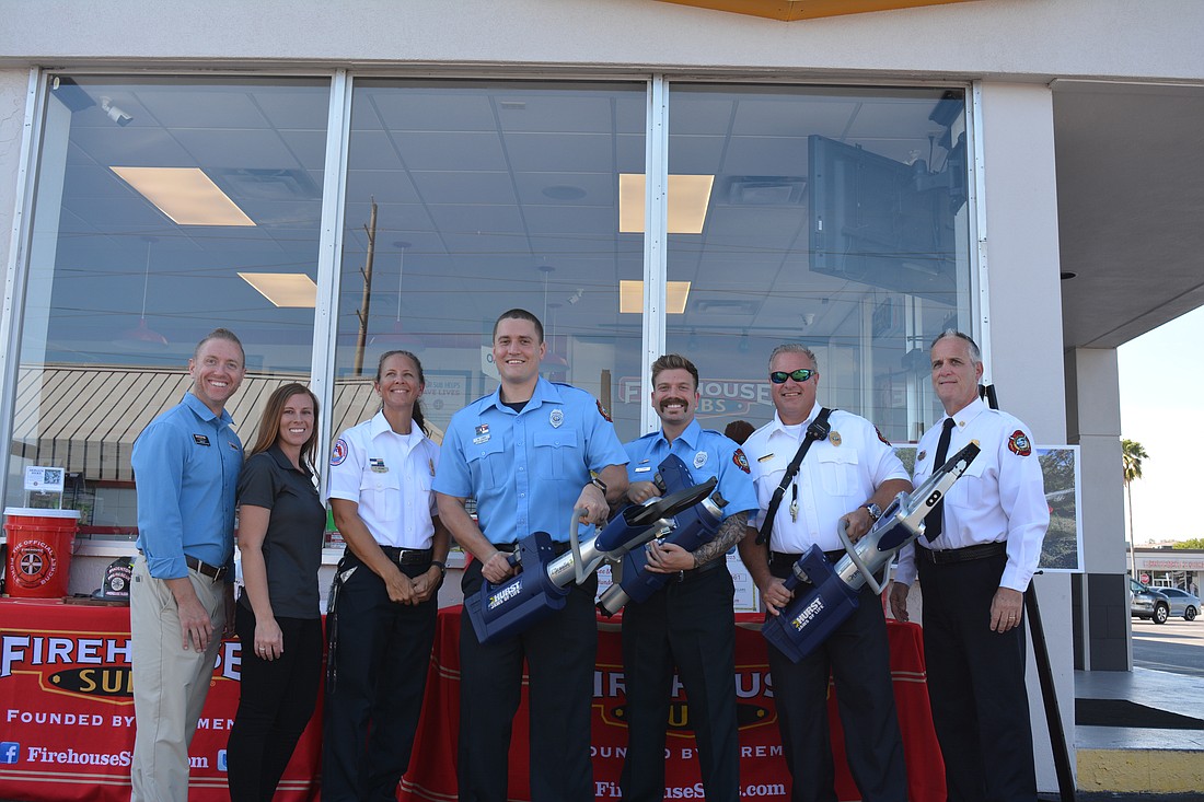 The Longboat Key Fire Rescue department shows off their new Jaws of Life equipment, purchsed with a $39,000 grant from Firehouse Subs. From left to right: John Cz, Kaite Fountain, Public Information Officer Tina Adams, William Lewis, Ryan Corso, Lt. Ron Koper and Chief Paul Dezzi.