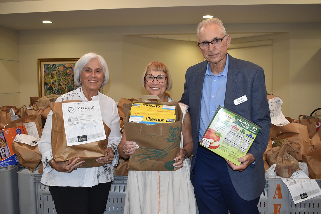 Social Action Committee chair Susan Rosenbaum and Social Action Committee member Barbara Peltz with her husband Mark Peltz.