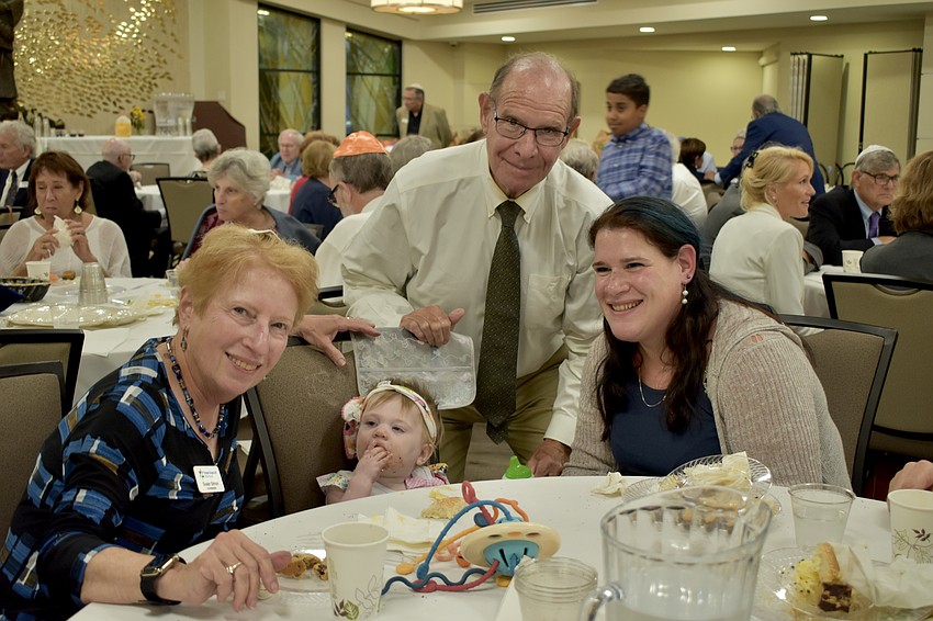 Sisterhood Co-President Susan Simon, 10-month-old Hannah Hubschmitt, Ken Simon and Heath Simon.
