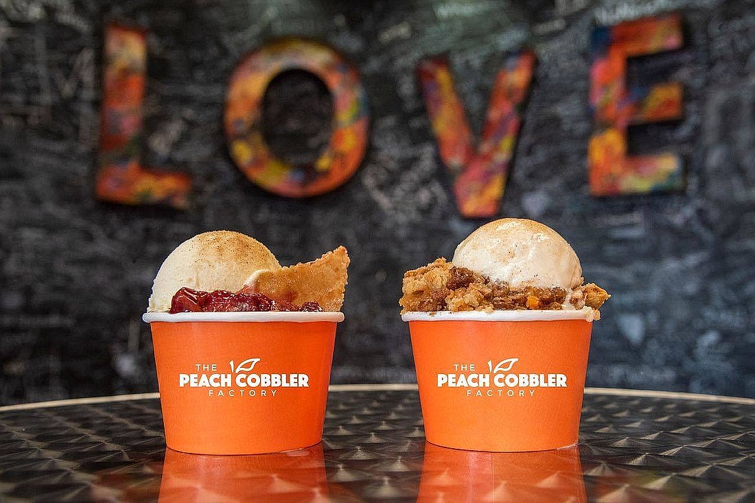 The Peach Cobbler factory offers a family-style dessert shop with cobbler, cinnamon rolls, banana pudding, peachy tea and cold brew coffee.