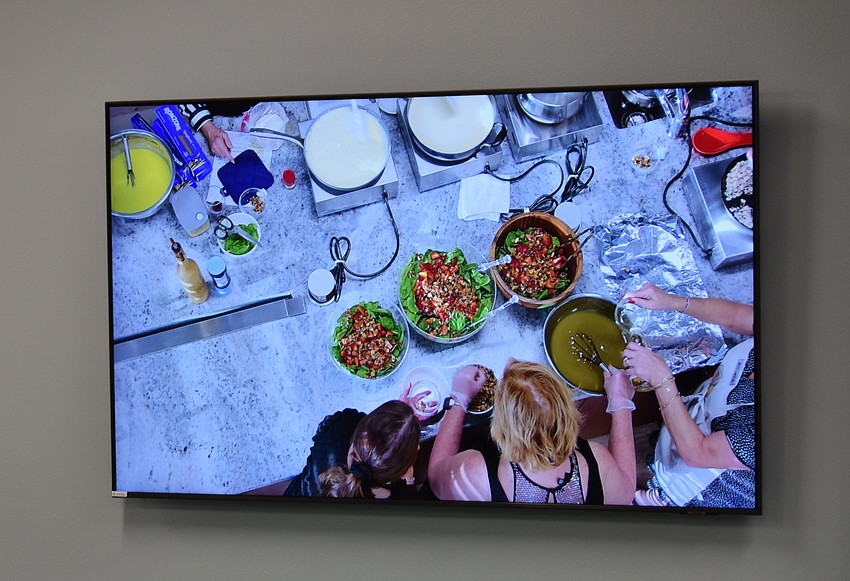 Those who weren't part of the cooking team would watch the preparation from above on big screens.