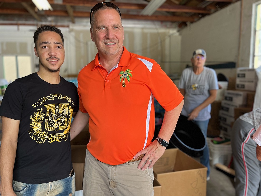 Ormond-by-the-Sea Lion Alfredo Victoriano and Oviedo-Winter Springs Lions President JC Alvarez at the Conklin Davis Center Warehouse staging area for hurricane supplies. Courtesy photo
