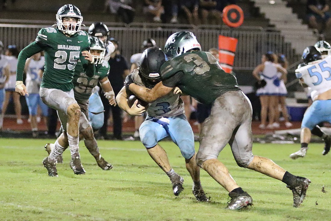 Colby Cronk (34) sacks Ponte Vedra’s Ben Burk in a game on Sept. 29, 2023. File photo by Christine Rodenbaugh