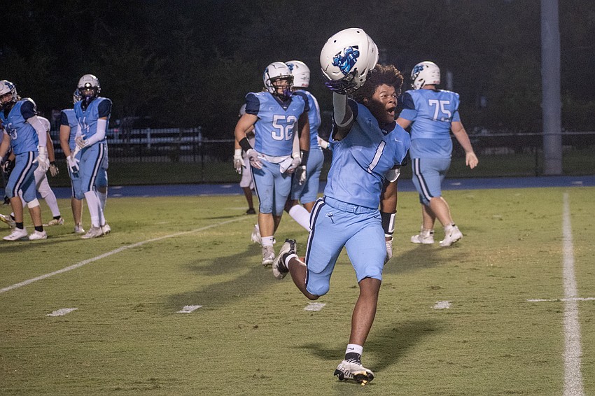 ODA defensive back Frankie Clark celebrates after a scoop-and-score touchdown on the game's first play from scrimmage.