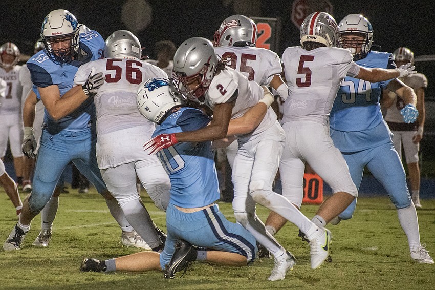 ODA linebacker Devin Erdei (30) puts a hit on Santa Fe receiver Dathan Glover (2).