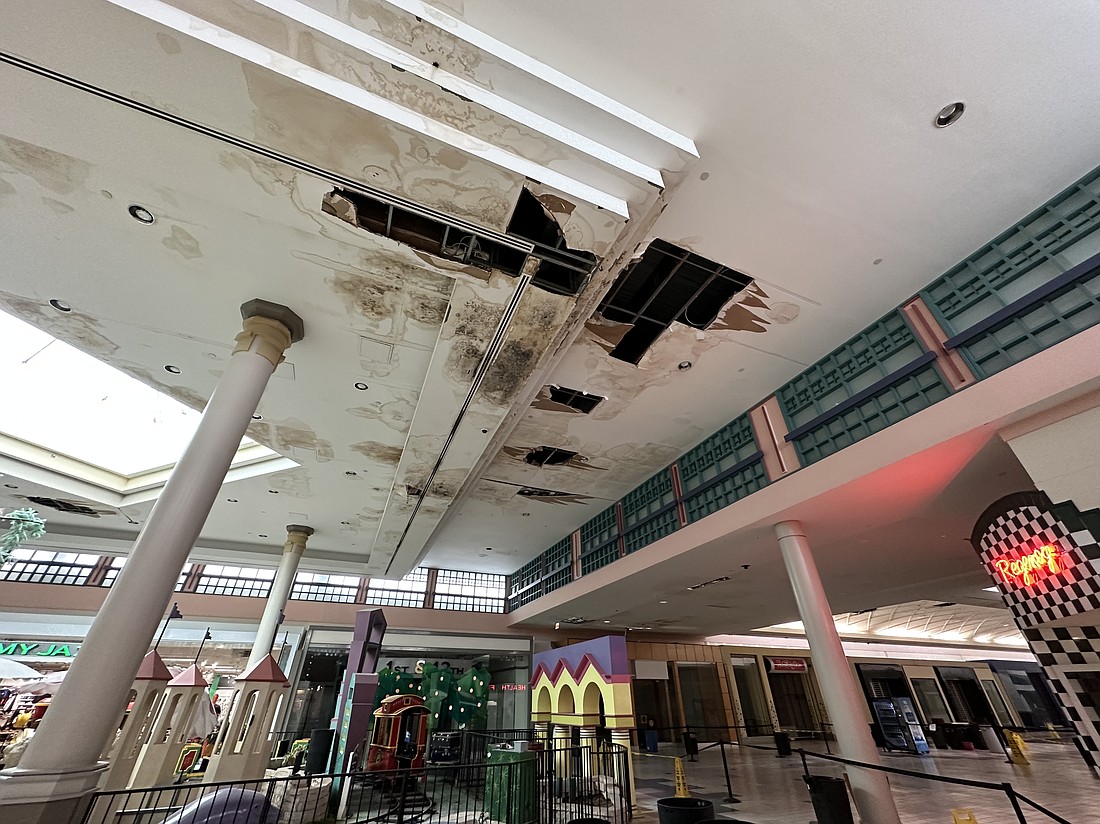 The water-damaged and stained ceiling at Regency Square Mall outside the Jimmy Jazz store near the center of what remains opens at the mall Sept. 29