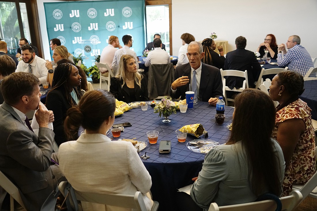 Fifth District Court of Appeal Judge Scott Makar speaks with Jacksonville University law students during lunch at JU’s River House after the court heard oral arguments at the Terry Concert Hall on Sept. 26.