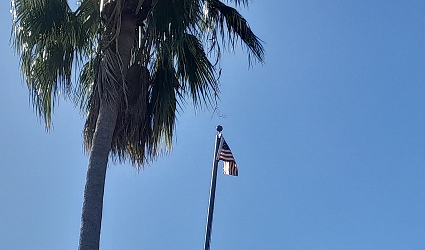 A tiny flag was raised in the Lowe's parking lot in Creekwood Crossing Thursday as part of 