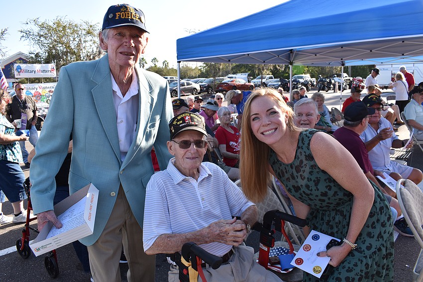 Event organizer Rich Koch, 105-year-old World War II veteran John Skeen and Koch's daughter, Heather Crawford, share a moment before the ceremony.