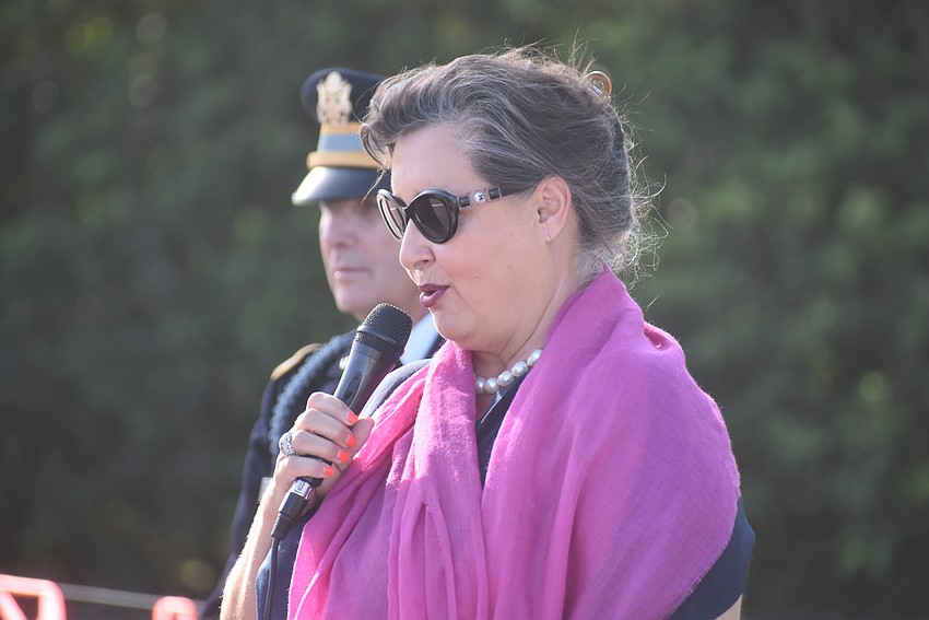 Anne Lancelle, an Honorary Consul representing France, thanks American servicemen for their sacrifices during World War II.