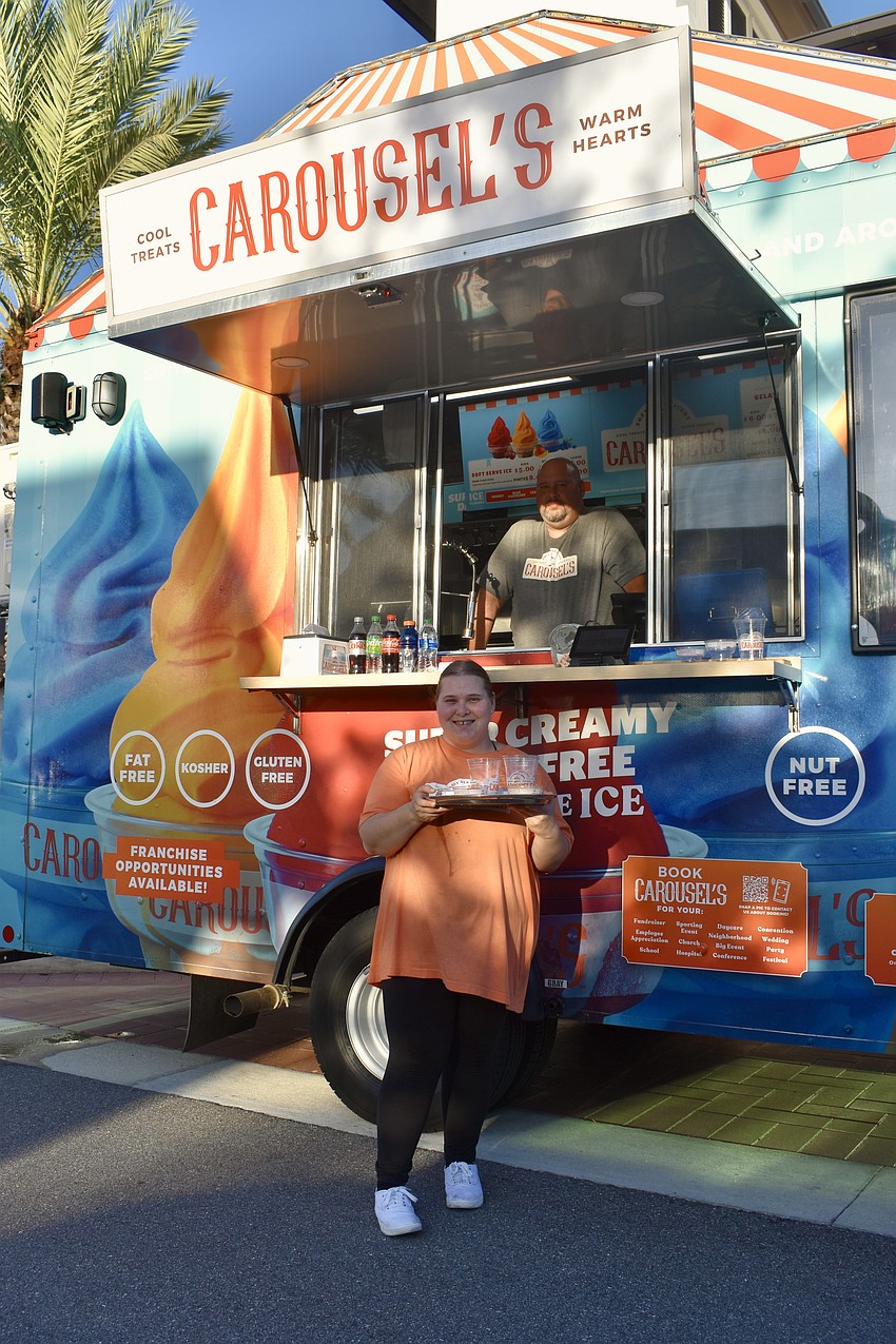Father and daughter John and Savannah Davis man the Carousel's truck at Ranch Nite.