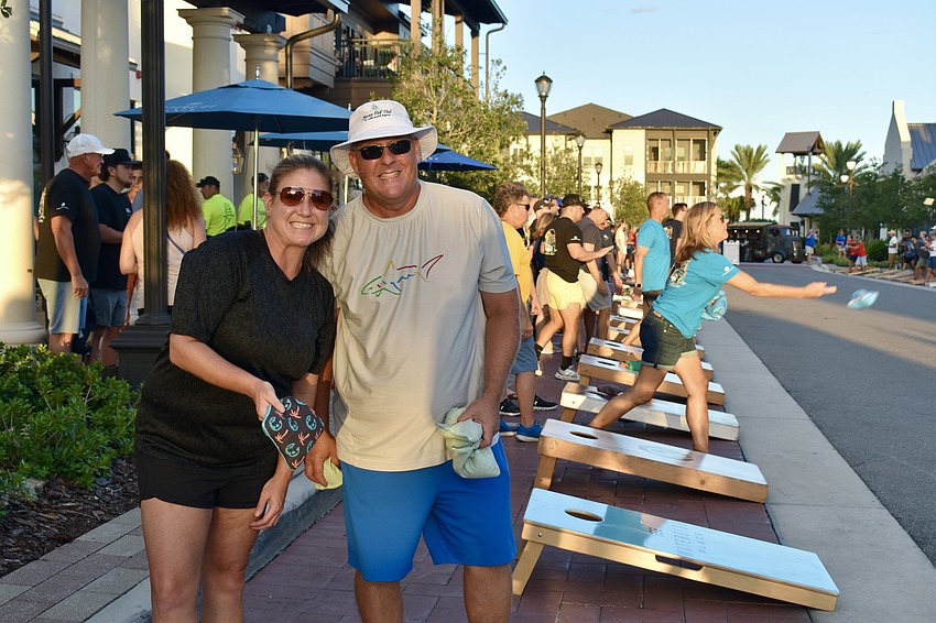Marcia Bailey and Carl Carbone have been playing cornhole at Waterside Place since the entertainment hub it opened.