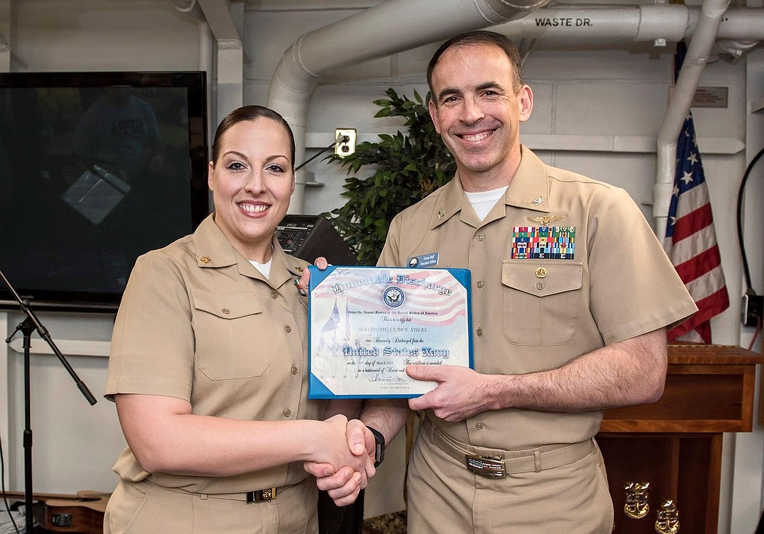 One of Stiles’ mentors, Capt. Gavin Duff, performed her re-enlistment on the USS George H.W. Bush (CVN 77).