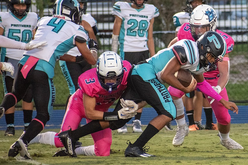 ODA senior John Moschella (3) makes the tackle on Bell Creek senior Manny Zelaya.