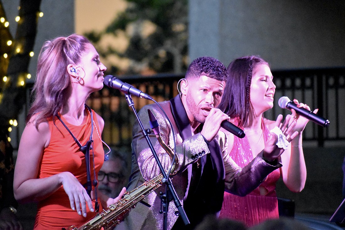 Amy Cyr, Grant Rhea and Domine Clemons perform with The Brett Foreman Band.