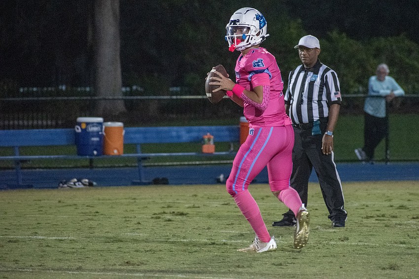 ODA junior quarterback Jackson Roth looks for a receiver downfield.