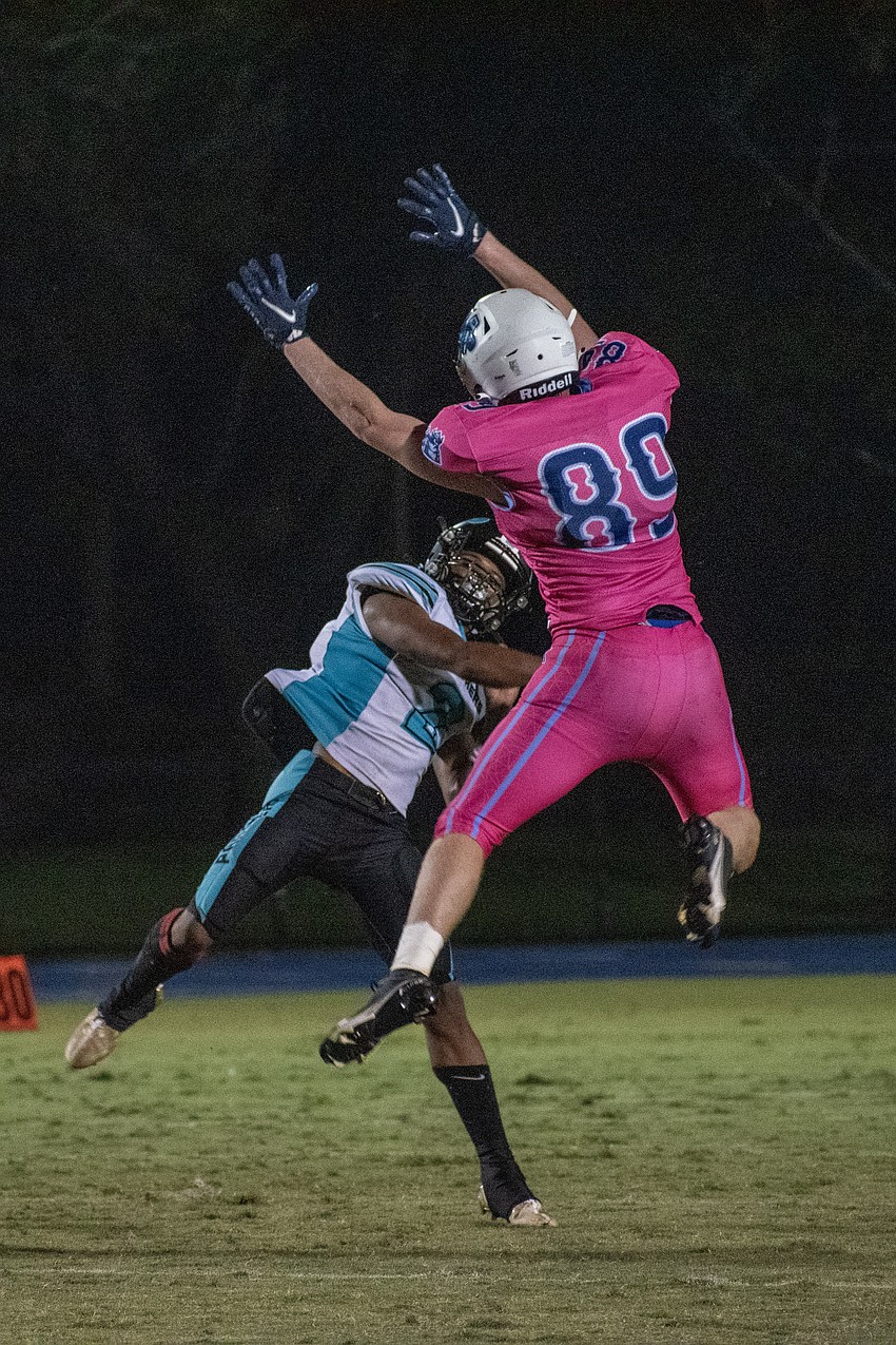 ODA senior defensive end Robert Crisci leaps to pressure Bell Creek senior quarterback Davis Quin'Darryn