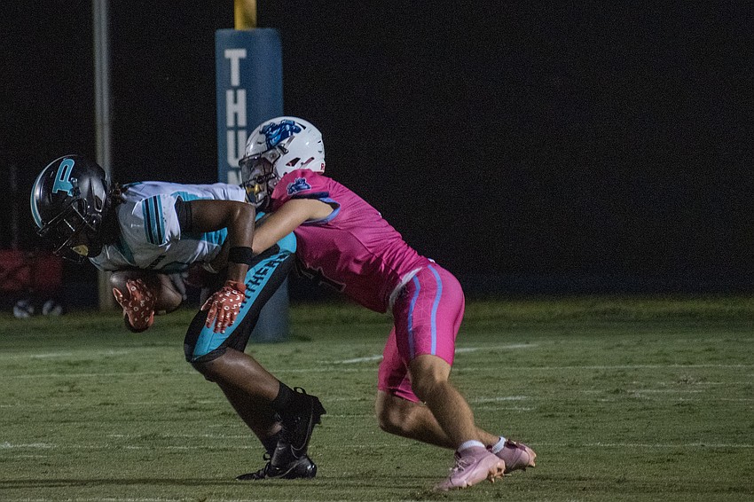ODA senior Jack Meyers makes a tackle on Bell Creek sophomore Juvandy Robinson.