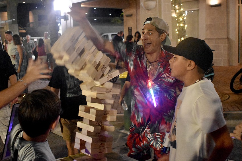 Peter Alexander, 10, Zach Maugh and Aiden Devera, 12 finish a game of Jenga.