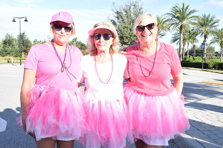 Del Webb's Susan Batchelder, Gail Hedy and Anne Rath are decked out in pink for the walk.