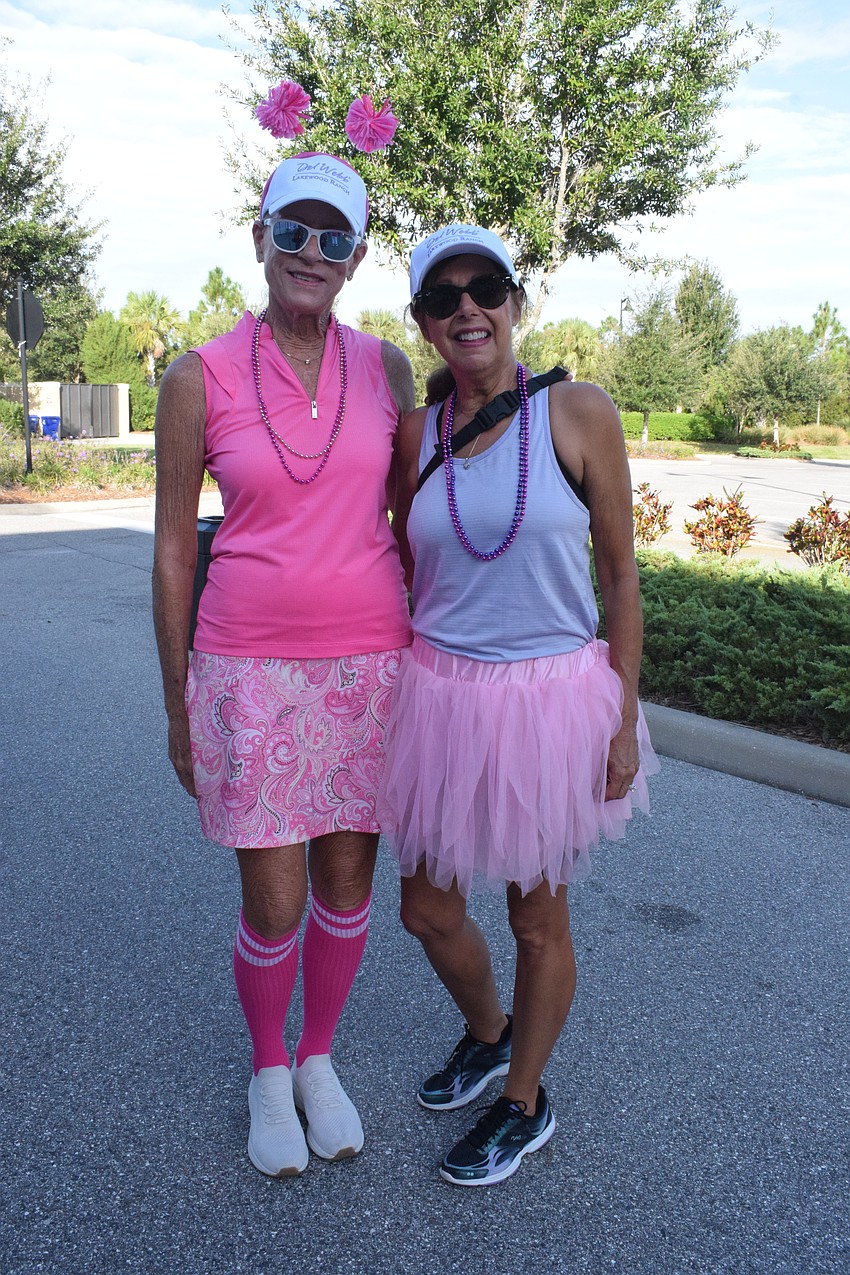 Esplanade's Lindy Foster and Del Webb's Debbie Stoner dress for the occasion. They say the walk brings a great sense of camaraderie.