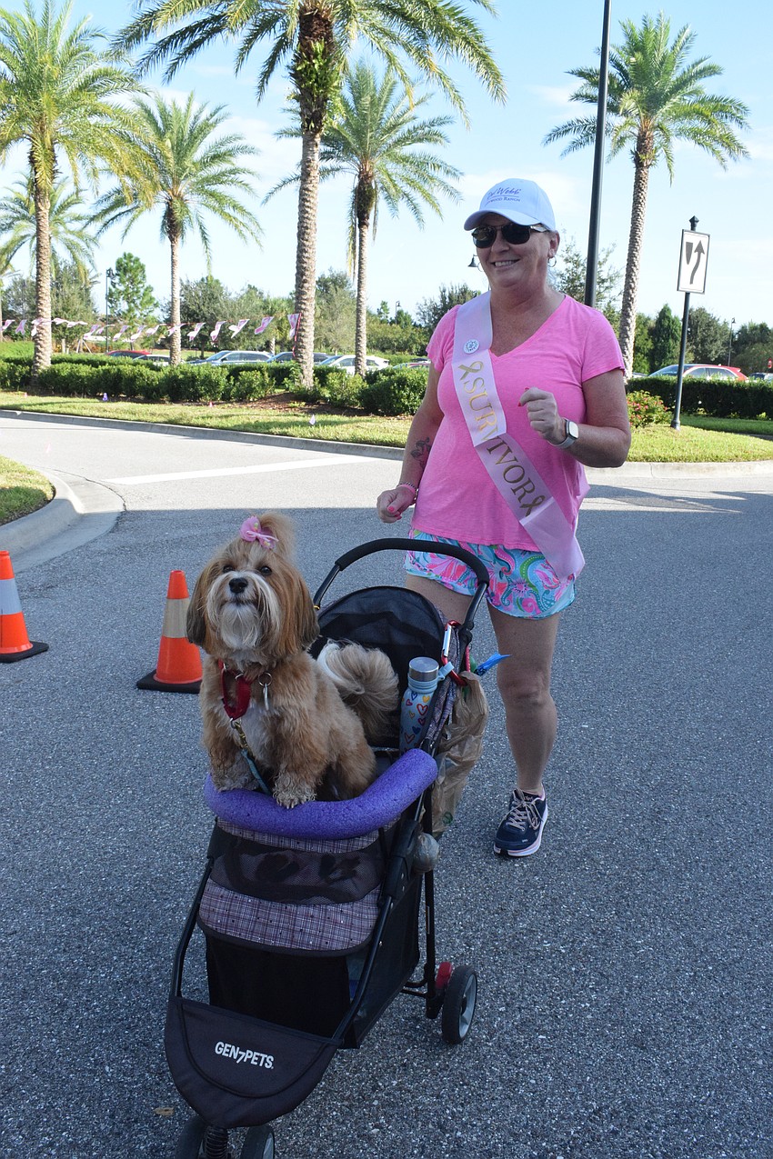 Del Webb's Teresa Morehead dances alongside her dog, Lola. Morehead was diagnosed with cancer in 2019. 