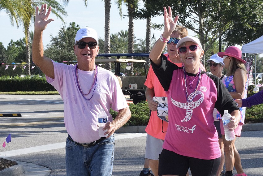 Del Webb's Paul Roy and Sheila Fritts start their walk with a pep in their step.